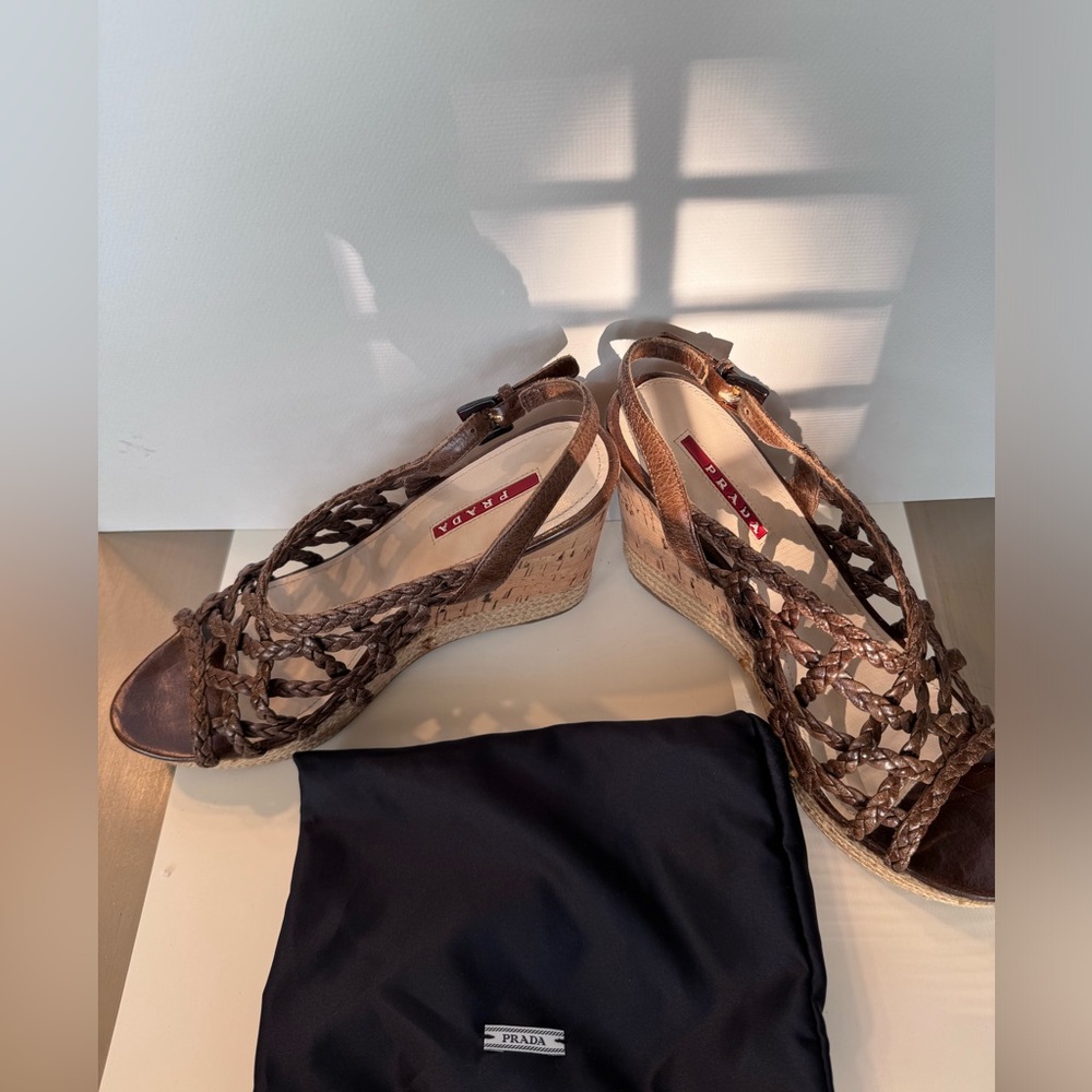 NWOT Prada wedge shoes with distressed leather braided design